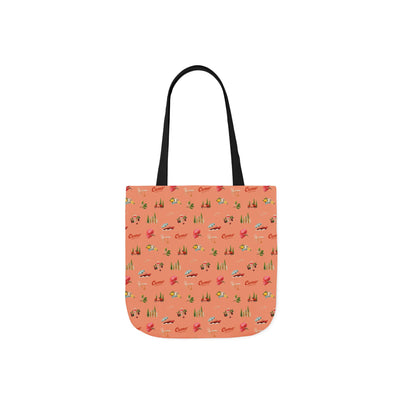 Tote bag with a pattern of small illustrations on a coral background
