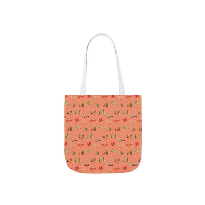 Tote bag with a pattern of small vehicles on a coral background
