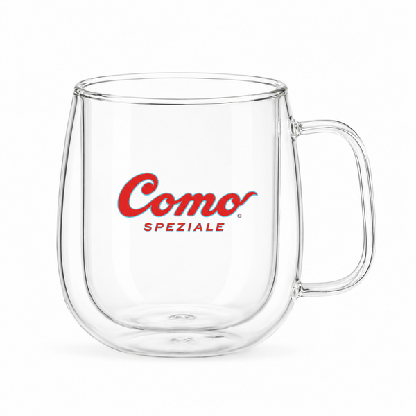 A clear double-walled glass mug with a red 'Como Speziale' logo printed on the front, set against a plain white background.